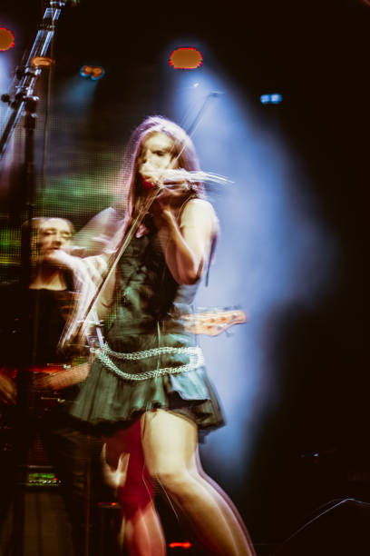 playing violin on rock koncert - concert stock pictures, royalty-free photos & images