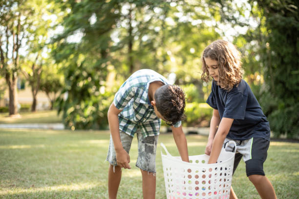 playing with water balloons - garden decoration stock pictures, royalty-free photos & images