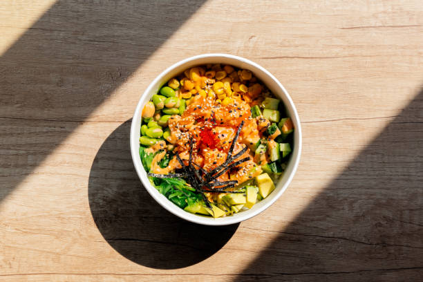poke bowl with salmon, directly above view - junk food stock pictures, royalty-free photos & images