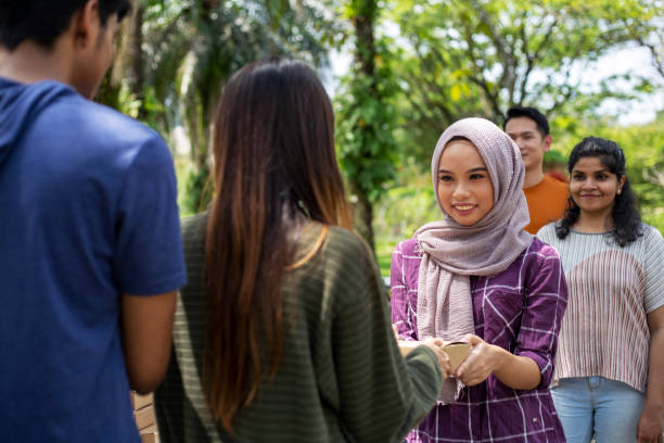 poor community queueing up to get free food from charity group - junk food stock pictures, royalty-free photos & images