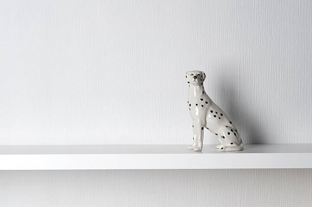porcelain dalmatian dog sitting on shelf - home decoration stock pictures, royalty-free photos & images