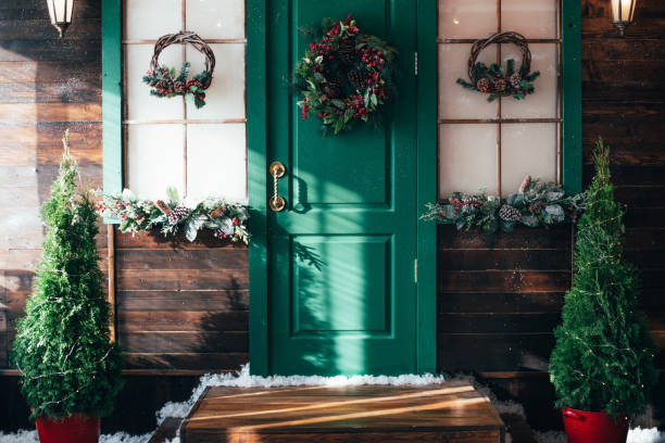 porch with wooden doors and a threshold with christmas decor. - garden decoration stock pictures, royalty-free photos & images