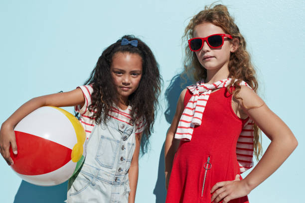 portrait cool girls together on blue backdrop in summer - fashion stock pictures, royalty-free photos & images