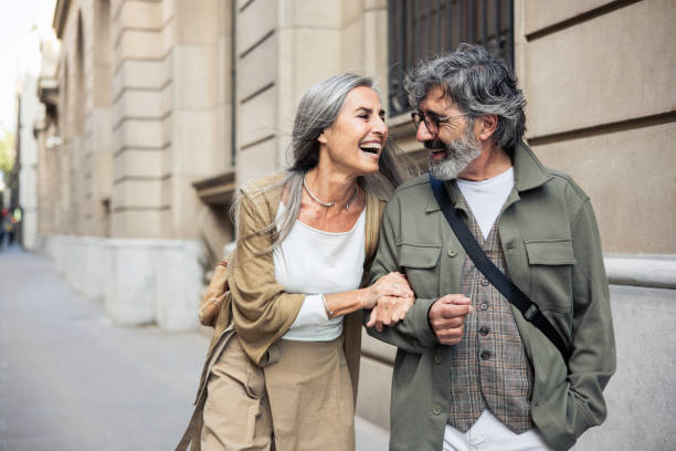 portrait of a happy mature couple having a fun vacation - travel stock pictures, royalty-free photos & images