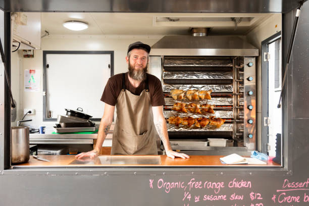 portrait of a man in his food truck - junk food stock pictures, royalty-free photos & images