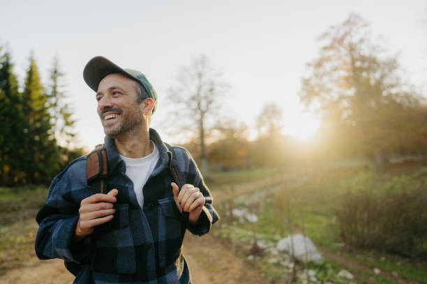 portrait of a mid adult male hiker - travel stock pictures, royalty-free photos & images