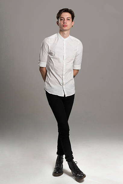 portrait of a young man indoors - fashion photos et images de collection