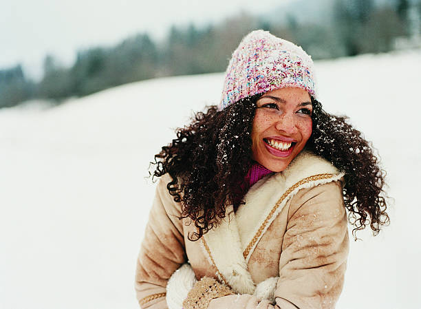 portrait of a young woman wearing a hat in the snow - fashion stock pictures, royalty-free photos & images