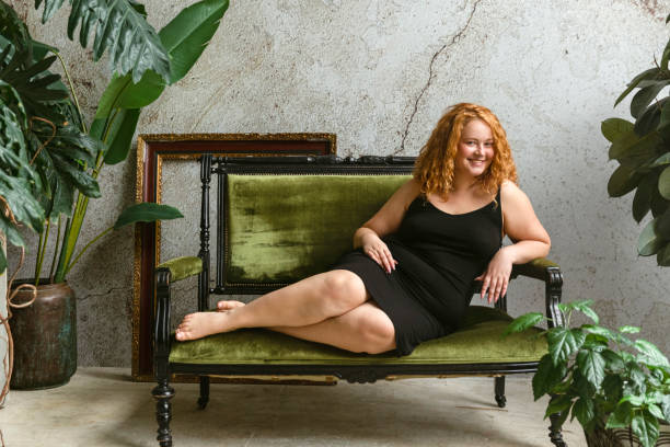 portrait of an attractive body positive woman - fashion stock pictures, royalty-free photos & images