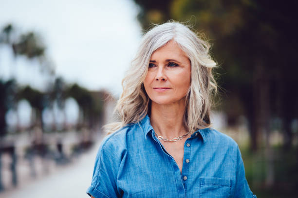 portrait of beautiful senior woman with grey hair outdoors - hairstyle stock pictures, royalty-free photos & images