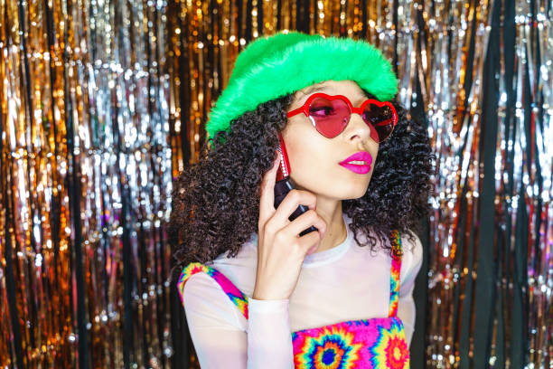 portrait of fashion model with bizarre outfit isoalted on party background - fashion stock pictures, royalty-free photos & images