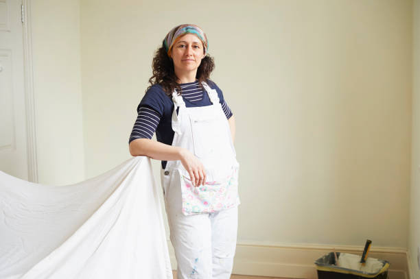 portrait of female painter and decorator - home decoration stock pictures, royalty-free photos & images
