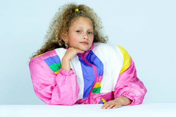 portrait of girl wearing huge jacket - fashion stock pictures, royalty-free photos & images