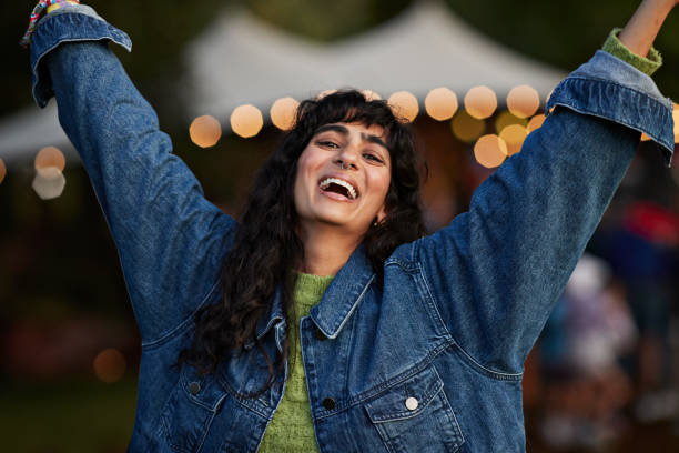 portrait of happy woman dancing to music - concert stock pictures, royalty-free photos & images