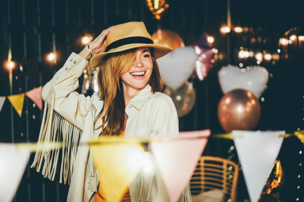 portrait of smiling woman at backyard party on summer evening - garden decoration stock pictures, royalty-free photos & images
