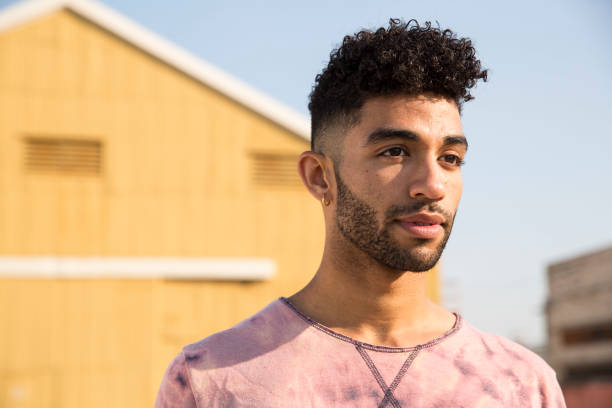 portrait of stylish young man outdoors - hairstyle stock pictures, royalty-free photos & images