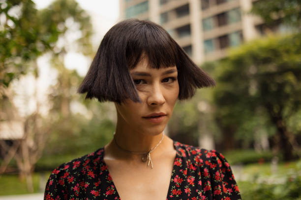 portrait of young asian fashion model in nature. - fashion stock pictures, royalty-free photos & images