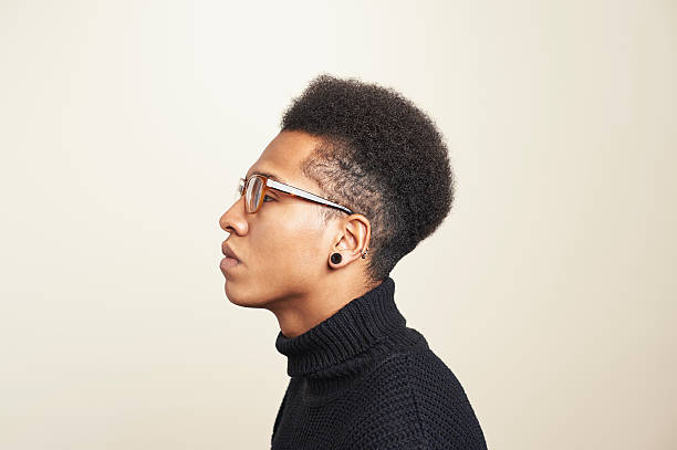 portrait of young man wearing glasses - hairstyle stockfoto's en -beelden