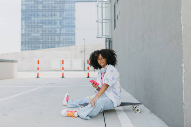portrait of young stylish generation z girl spending time outdoor after school. - fashion stock pictures, royalty-free photos & images