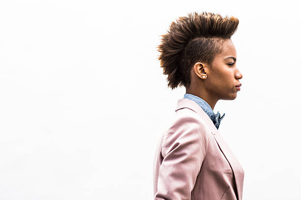 portrait of young woman on plain background - hairstyle stockfoto's en -beelden
