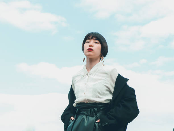 portrait young asian woman outdoor looking at camera - fashion stock pictures, royalty-free photos & images