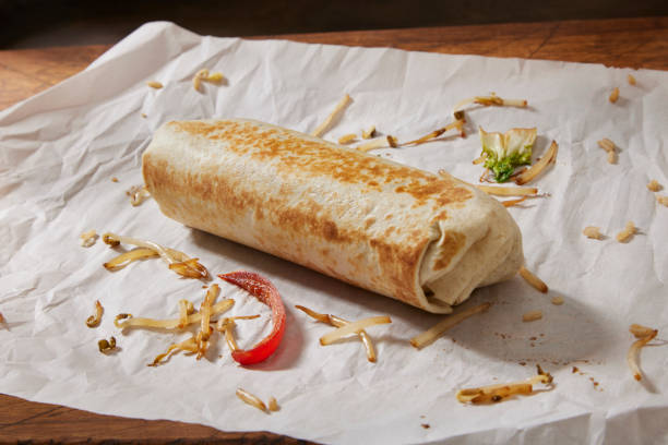 preparing the copycat chinese food burrito - junk food stock pictures, royalty-free photos & images