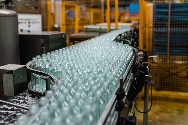 production line for juice bottling - food stock pictures, royalty-free photos & images