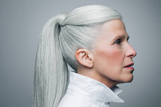 profile of mature woman with grey hair, portrait. - hairstyle stockfoto's en -beelden
