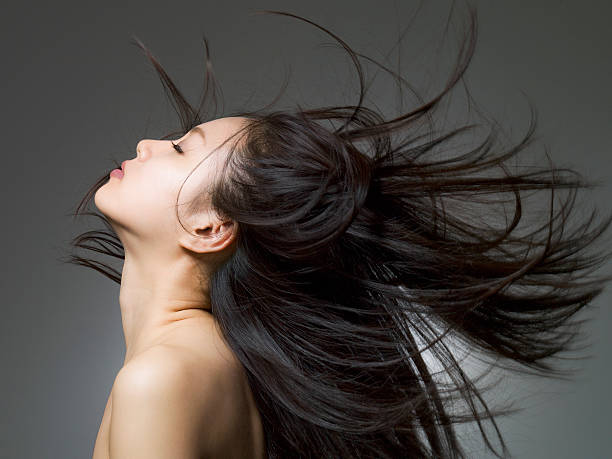 profile shot of the woman who looks up - hairstyle stock pictures, royalty-free photos & images