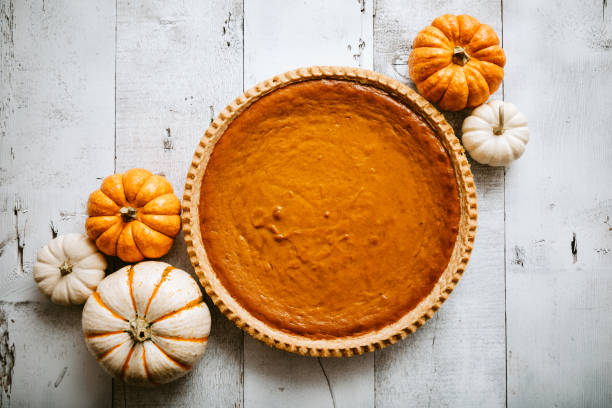 pumpkin pie on rustic background - food stock pictures, royalty-free photos & images