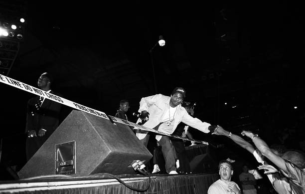 Rapper Eazy-E from N.W.A. Greets fans during his performance during the 'Straight Outta Compton' tour at the Mecca Arena in Milwaukee, Wisconsin in...