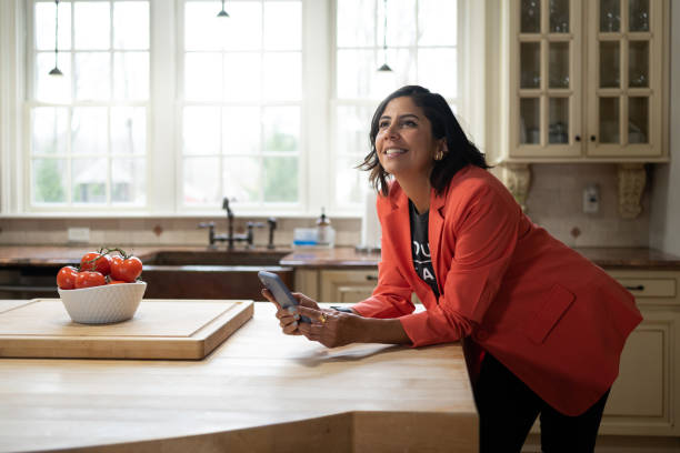 real state woman working from home using cellphone - home decoration stock pictures, royalty-free photos & images