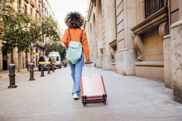 rear view of a girl on a journey - travel stockfoto's en -beelden