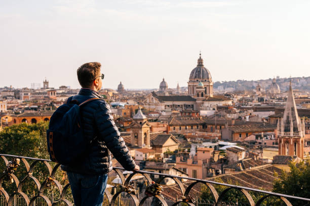 rear view of a man looking at rome skyline from above, italy - travel stock pictures, royalty-free photos & images
