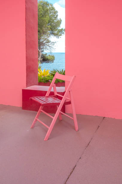 red chair with the mediterranean sea view and red architecture. - garden decoration stock pictures, royalty-free photos & images