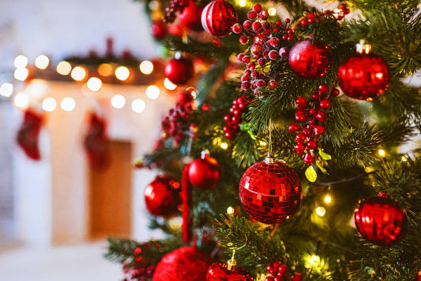 red christmas tree and fireplace decoration, merry christmas and happy new year, red and white christmas decor design, christmas background - home decoration stock pictures, royalty-free photos & images