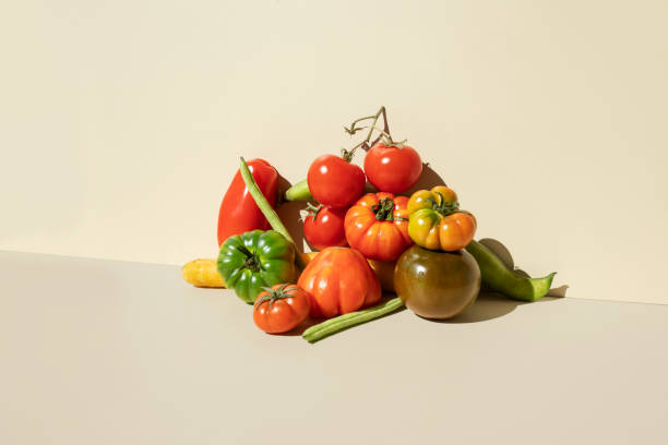 red,green tomatoes, carrots and green beans on the beige background - food stock pictures, royalty-free photos & images