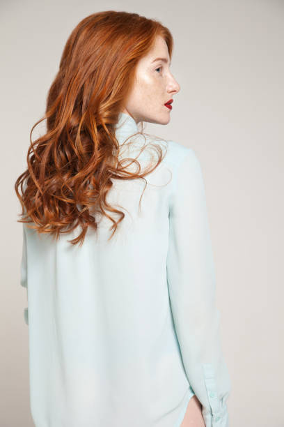 redhead woman in blue blouse - fashion stock pictures, royalty-free photos & images