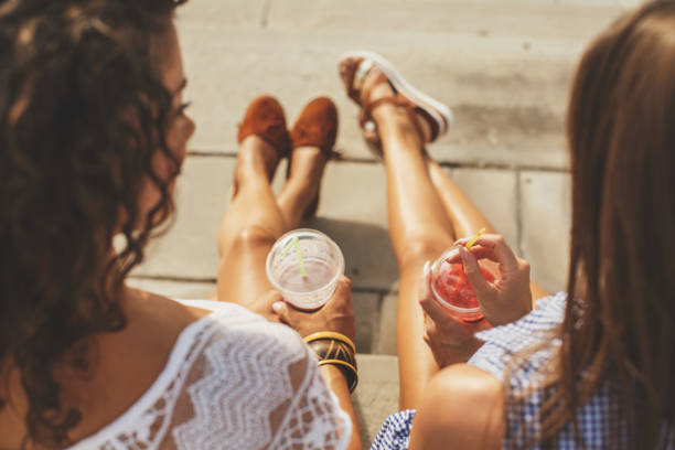 relaxing and tanning - junk food stock pictures, royalty-free photos & images