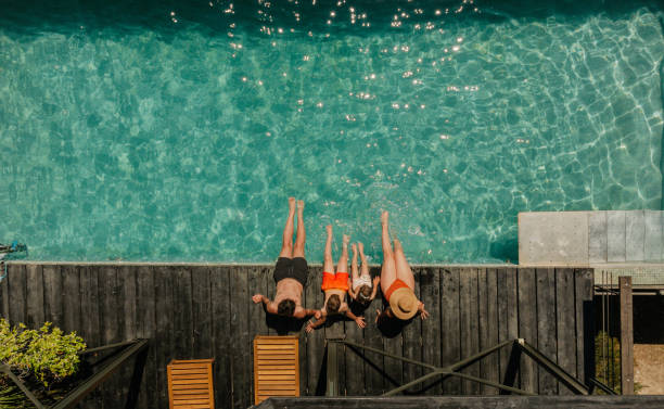 relaxing by the pool - travel stock pictures, royalty-free photos & images