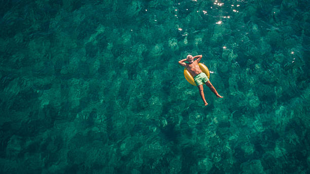 relaxing in the sea - travel stock pictures, royalty-free photos & images