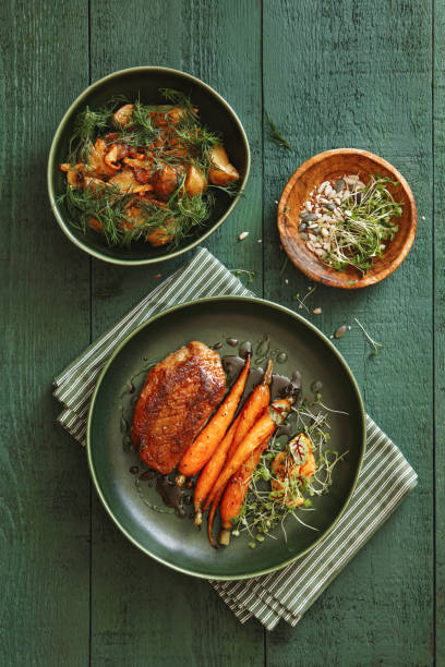 roast duck breast with vegetables - food stock pictures, royalty-free photos & images