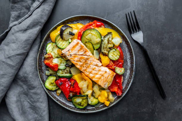 roasted salmon with vegetables - food stock pictures, royalty-free photos & images