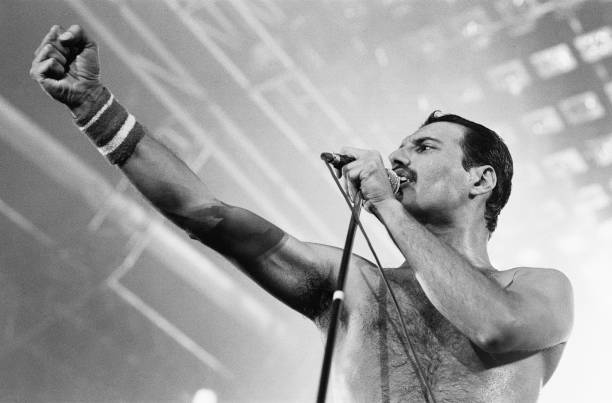 Rock group Queen in concert at Wembley Arena. Lead singer Freddie Mercury performing on stage on his 38th birthday. 5th September 1984.