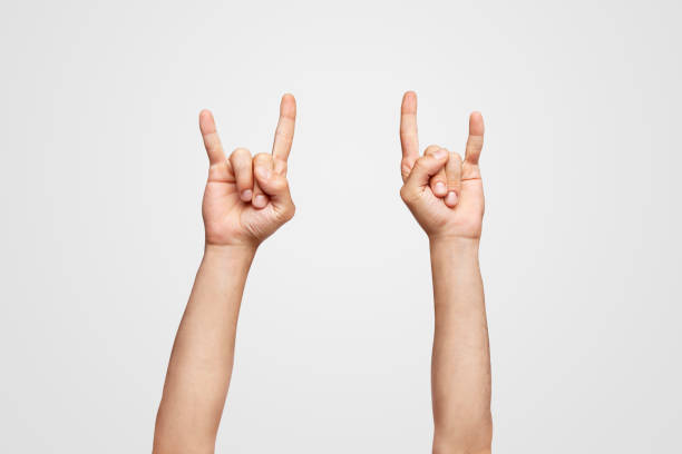 rock & roll hand symbol - concert stock pictures, royalty-free photos & images