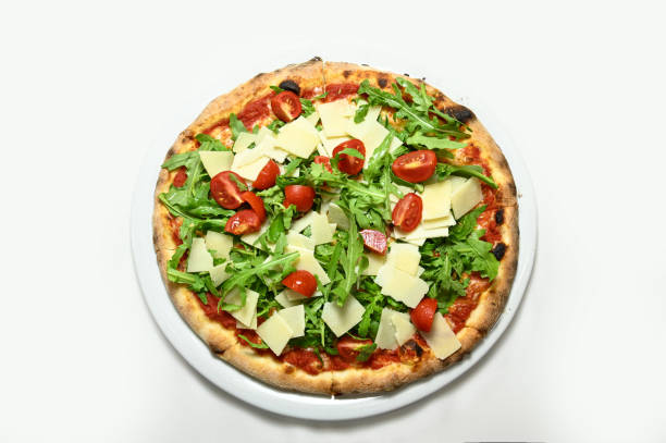 rocket pizza, parmesan, cherry tomatoes - junk food stock pictures, royalty-free photos & images