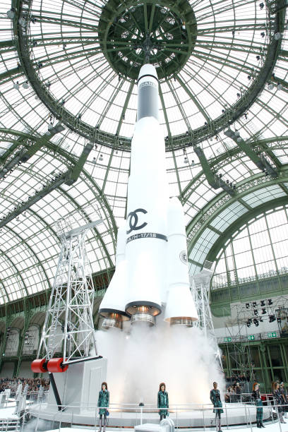 Rocket takes off as Models walk the runway at the end of the Chanel show as part of the Paris Fashion Week Womenswear Fall/Winter 2017/2018 on March...