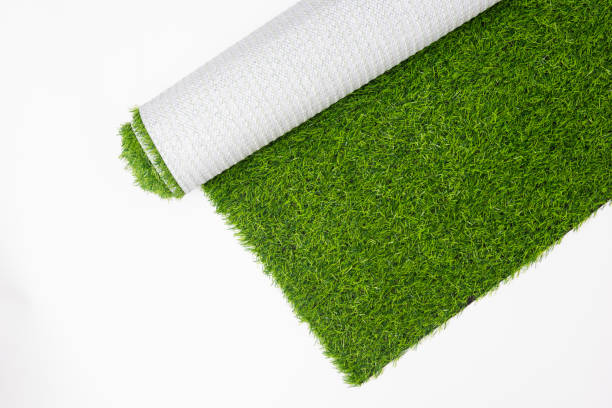 rolls of artificial lawn on a white background - garden decoration stock pictures, royalty-free photos & images