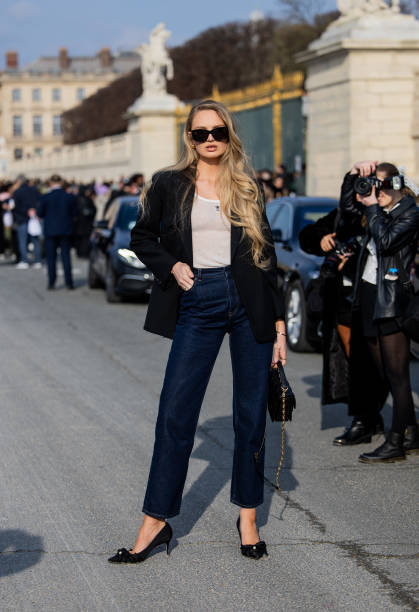 Romee Strijd wears black blazer, white shirt, denim jeans, black bag, sunglasses outside Dior during the Womenswear Fall/Winter 2024/2025 as part of...