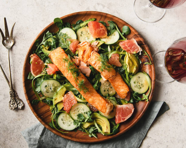 salmon over watercress salad - food stock pictures, royalty-free photos & images